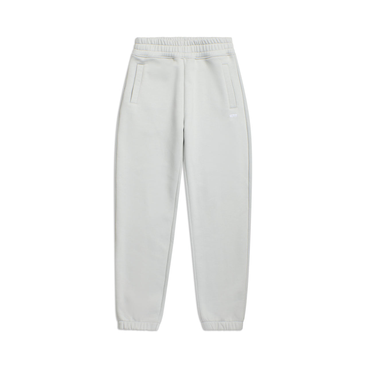 CUFF JOGGER SMOKE GREY: Classic light grey sweatpants featuring an elastic waistband, side pockets, and cuffed ankles, shown on a plain white background.