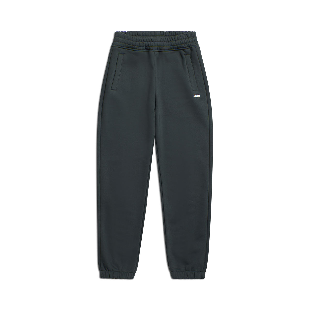 The 6PM CUFF JOGGER DARK EMERALD features an elastic waistband, side pockets, cuffed leg openings, and a small white logo on the upper left thigh. The signature pants are displayed flat against a white background.
