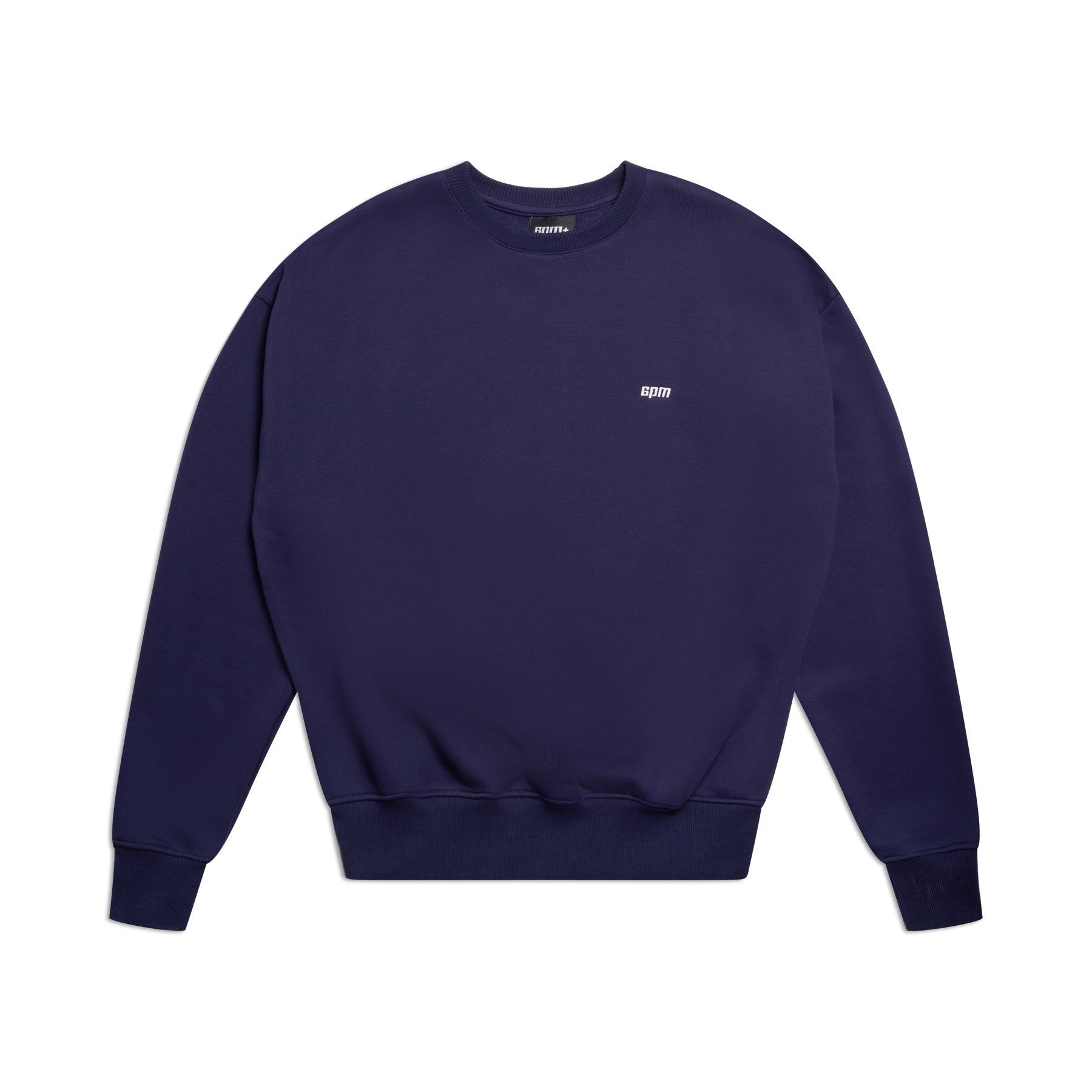 The CREWNECK ORBIT BLUE by 6PM is a navy blue crewneck sweatshirt with long sleeves, ribbed trims, and a small white spirit logo on the left chest, displayed flat on a white background.