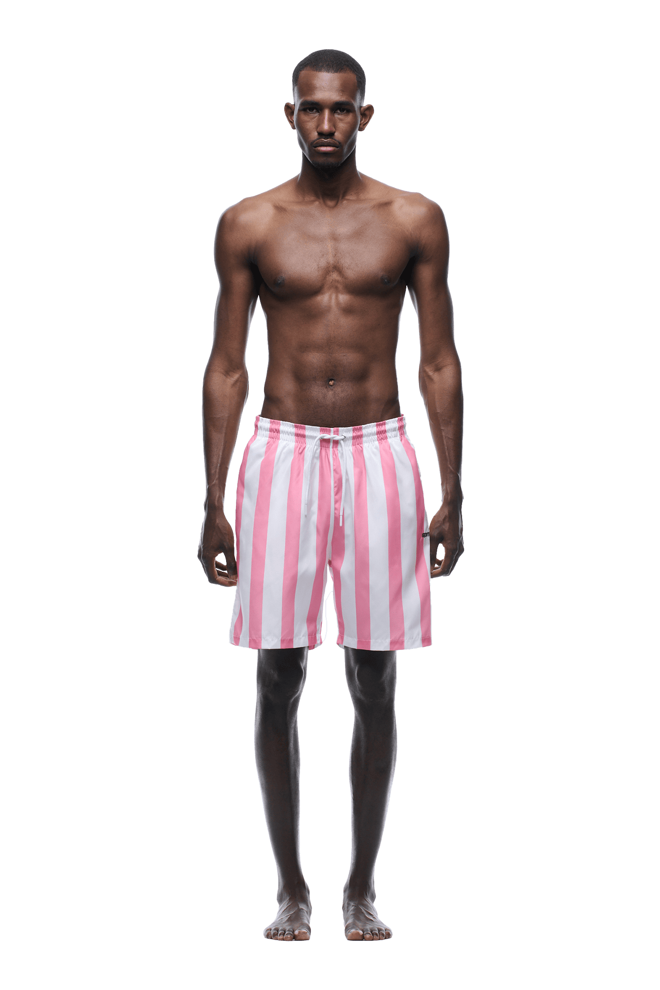 A barefoot man faces forward, wearing the 6PM STRIPED SWIM SHORTS WHITE/PINK. He is shirtless and posed against a plain green background.