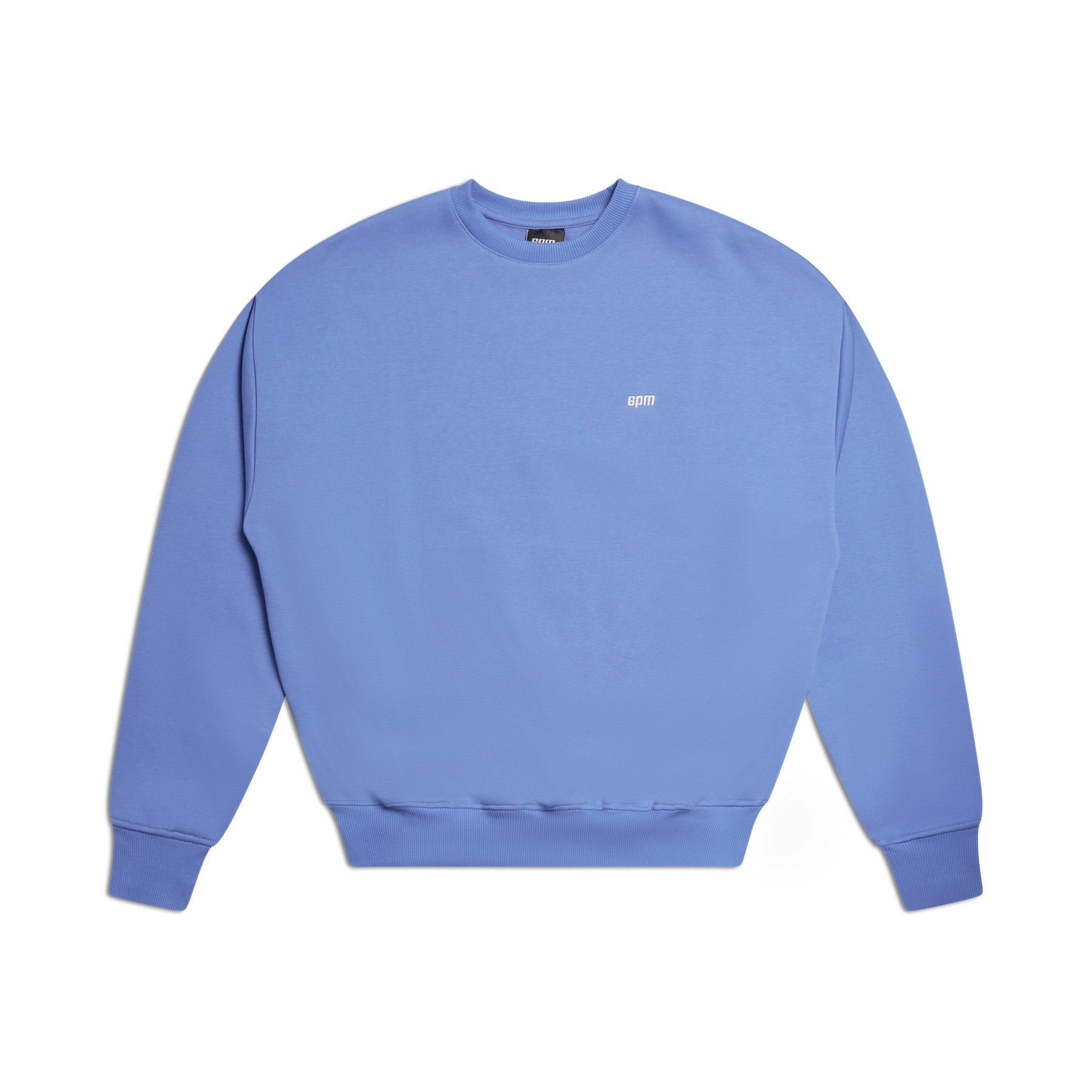 The 6PM CREWNECK PERSIAN BLUE is a light purple crewneck sweatshirt featuring long sleeves, ribbed trims, and a small white logo on the chest, shown laid flat on a white background.