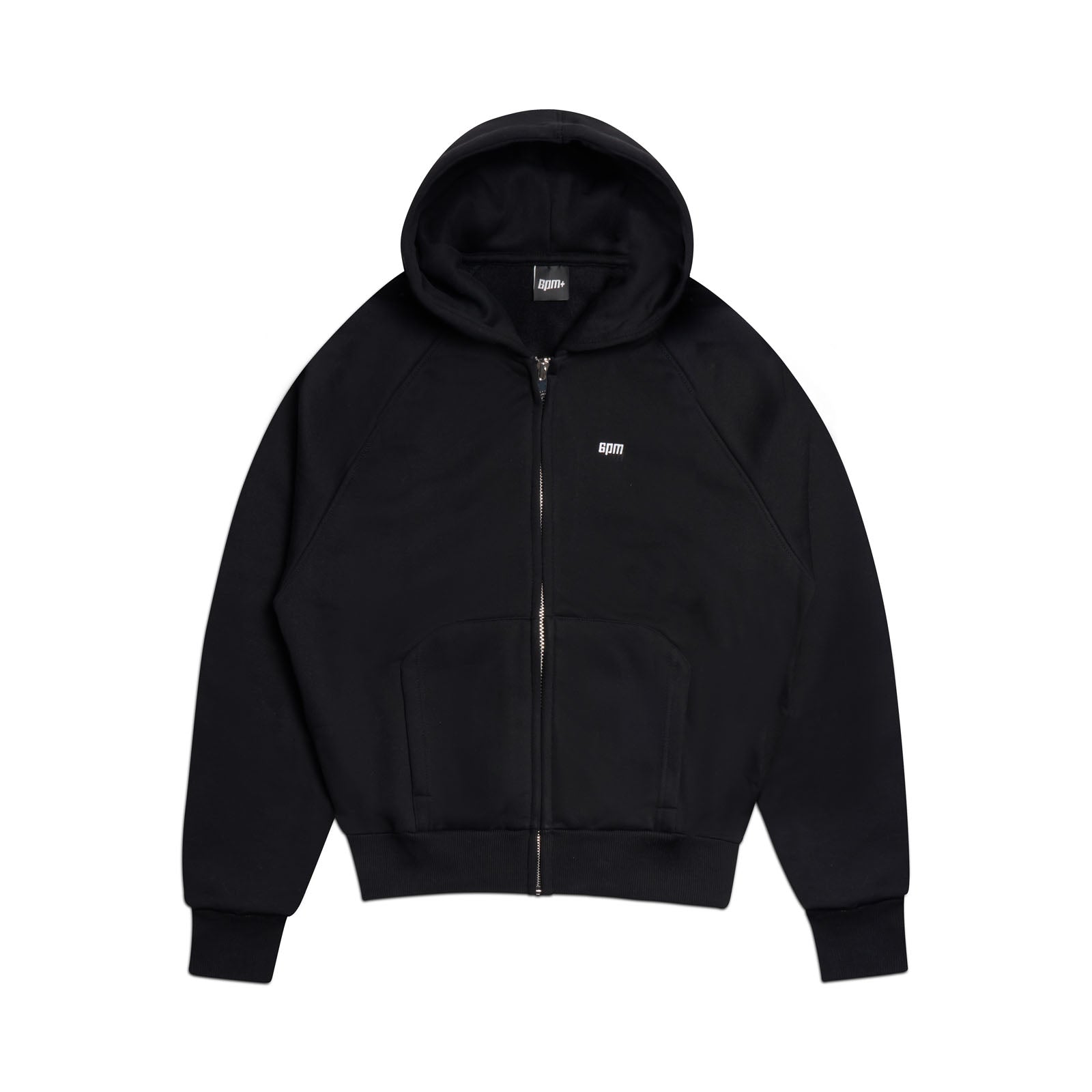 The 6PM ZIP HOODIE BLACK is a plain black zip-up with front pockets, a drawstring hood, and small white chest text. Displayed flat on a white background, it features a clean finish and versatile style for everyday wear.