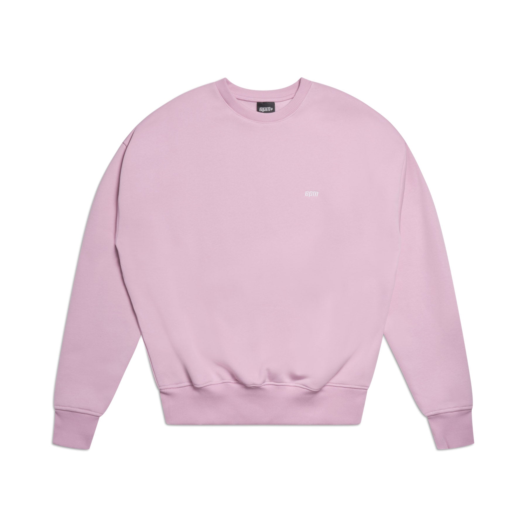 The 6PM CREWNECK BABY PINK is a plain, boxy fit sweatshirt in light pink with long sleeves, ribbed trims, and a small white logo on the upper chest, shown laid flat on a white background.