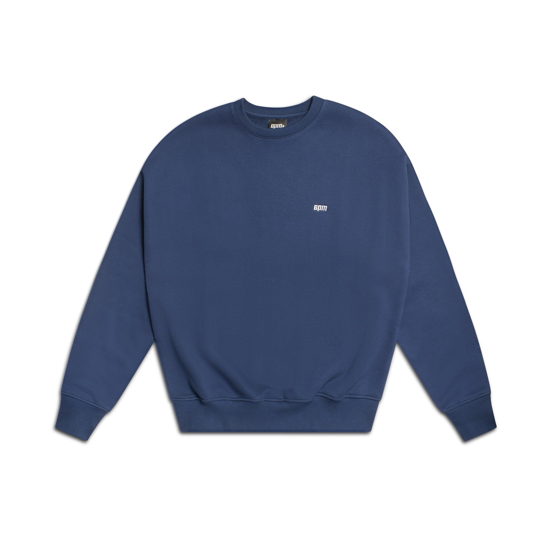 The 6PM CREWNECK NAVY is a plain navy blue sweatshirt with long sleeves, ribbed cuffs and hem, and a small white embroidered logo on the left chest, shown against a white background.