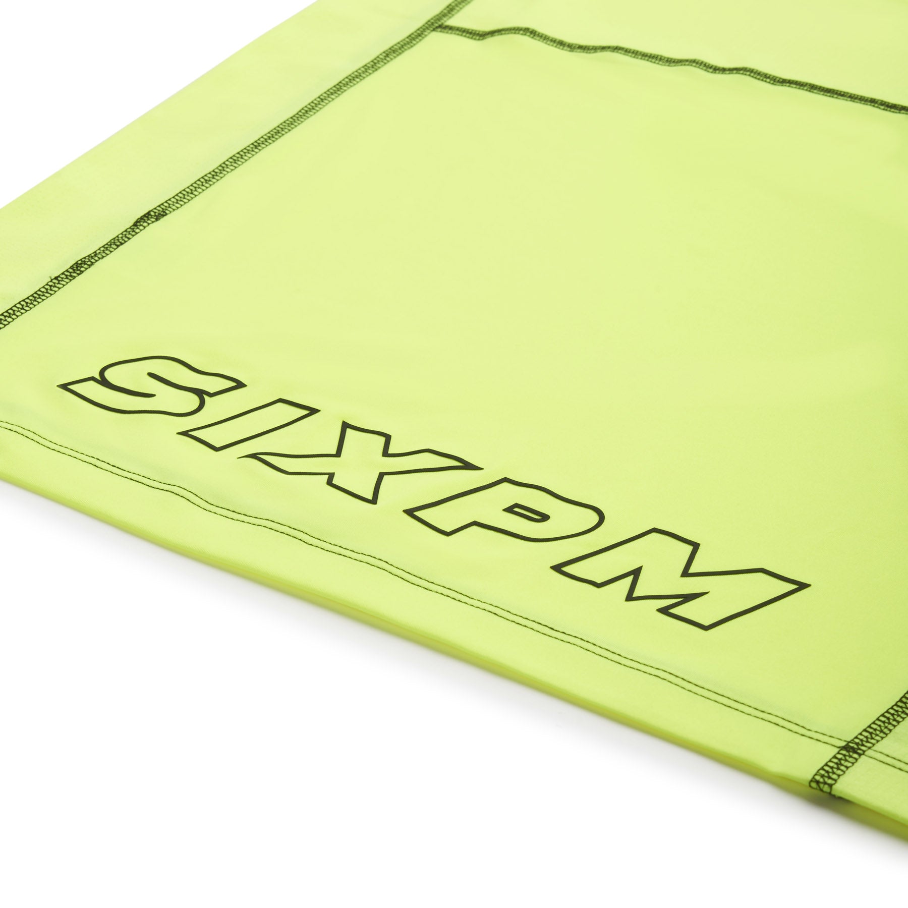 A close-up of the 6PM SPORTS T-SHIRT NEON YELLOW by 6PM shows bold, outlined "SIXPM" lettering near the edge and visible stitching along the seams.