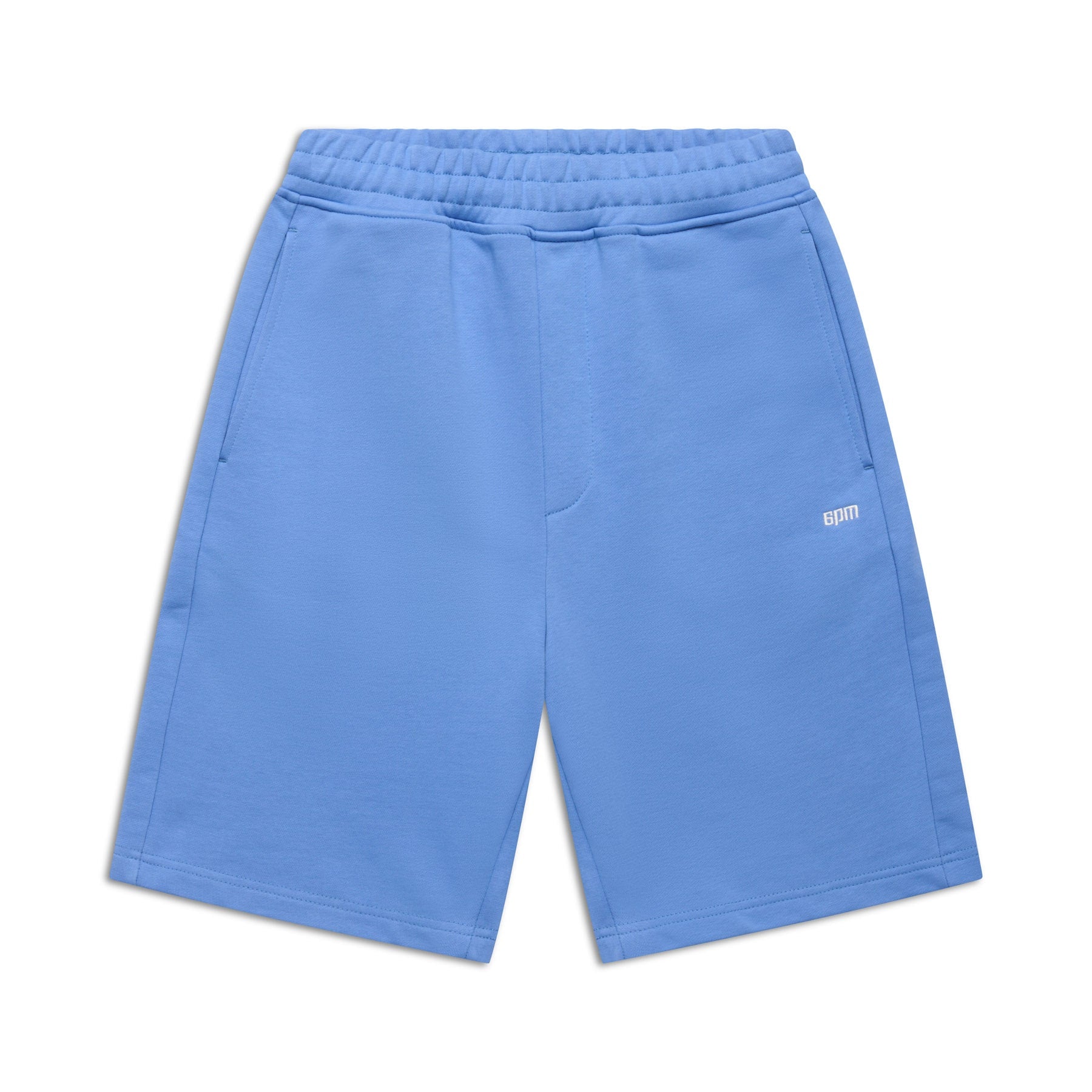 6PM 6PM+ SHORTS PERSIAN BLUE feature a relaxed fit, soft brushed interior, elastic waistband, two side pockets, and a small white BRM logo on the left thigh. Displayed laid flat against a white background.