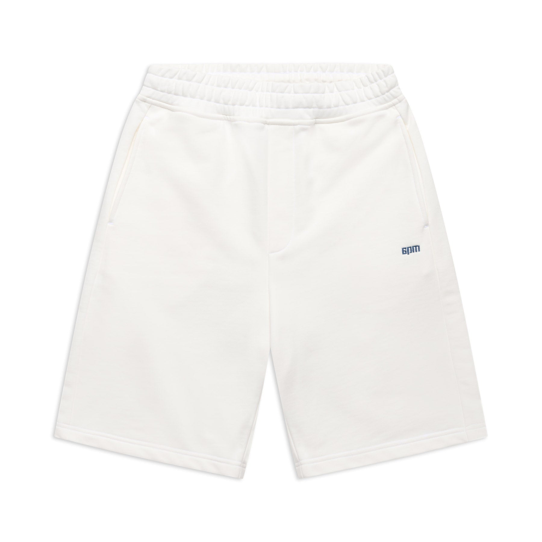 6PM+ SHORTS COCONUT WHITE by 6PM: white athletic shorts featuring a relaxed fit, elastic waistband, side pockets, and a small blue spm logo on the left thigh—ideal for lounging. Shown flat on a white background.