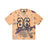 The CAMO JERSEY BURRO by 6PM is a short-sleeve jersey in orange and brown camo, featuring a large black-outlined number 96 and SIXPM on the front, with logos on the chest and bottom left.