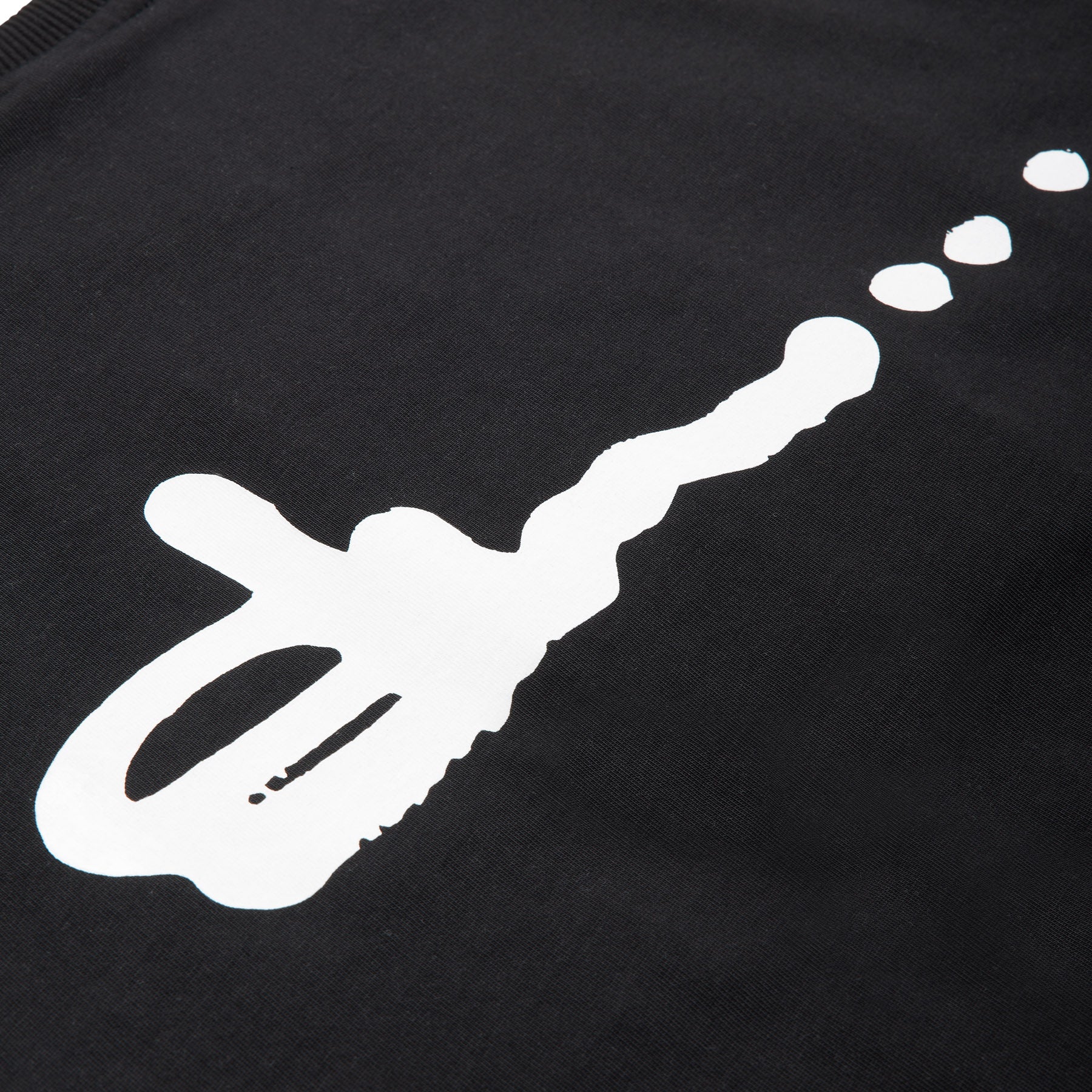 The SLAWN SIGNATURE TEE BLACK by 6PM features a bold white abstract design with three dots trailing right on black fabric.