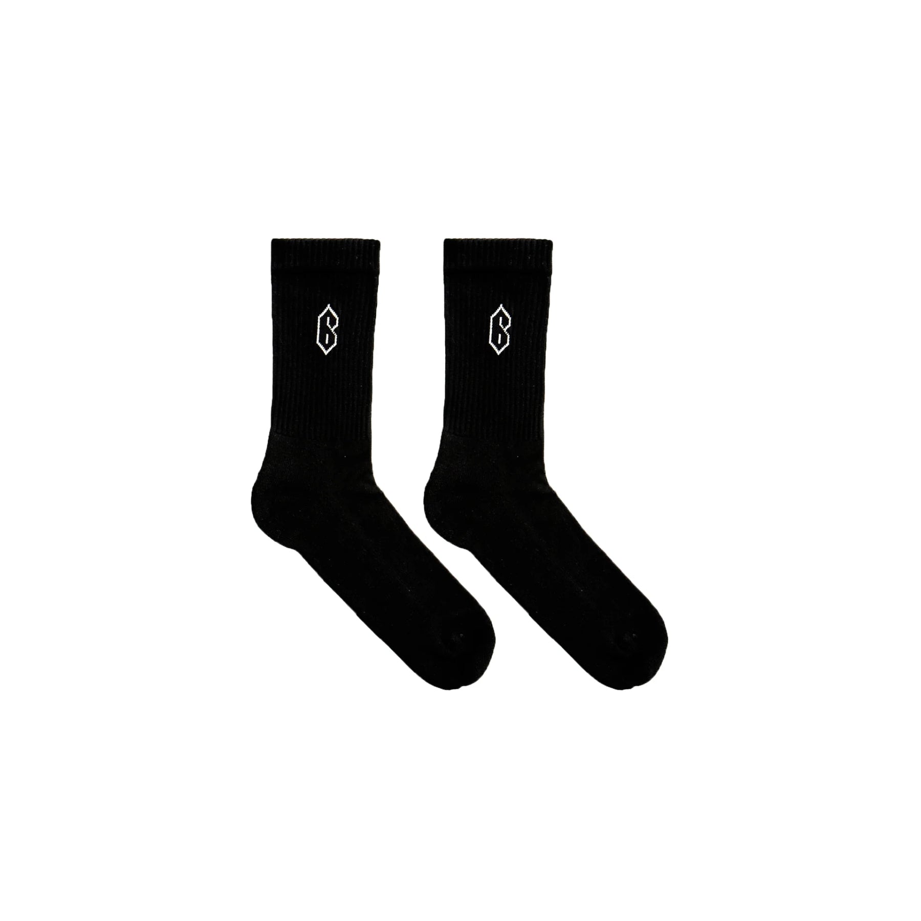 6PM TENNIS SOCKS BLACK (2-PACK) features black crew socks with a small white intarsia logo on the side, crafted from a soft cotton/poly blend and shown on a plain white background.
