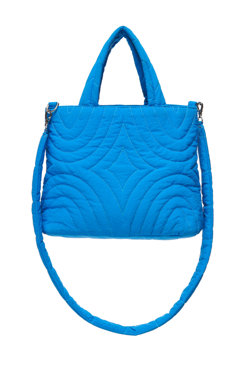 The 6PM MEDINA BAG BLUE is a bright blue quilted handbag featuring diamond and curved stitching, two short handles, and a detachable shoulder strap, shown on a white background.