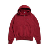 The 6PM ZIP HOODIE WINE RED is a maroon zip-up with a front pocket, hood, and subtle white chest logo. Shown on a white background, it’s designed for everyday comfort and features a clean, stylish finish.