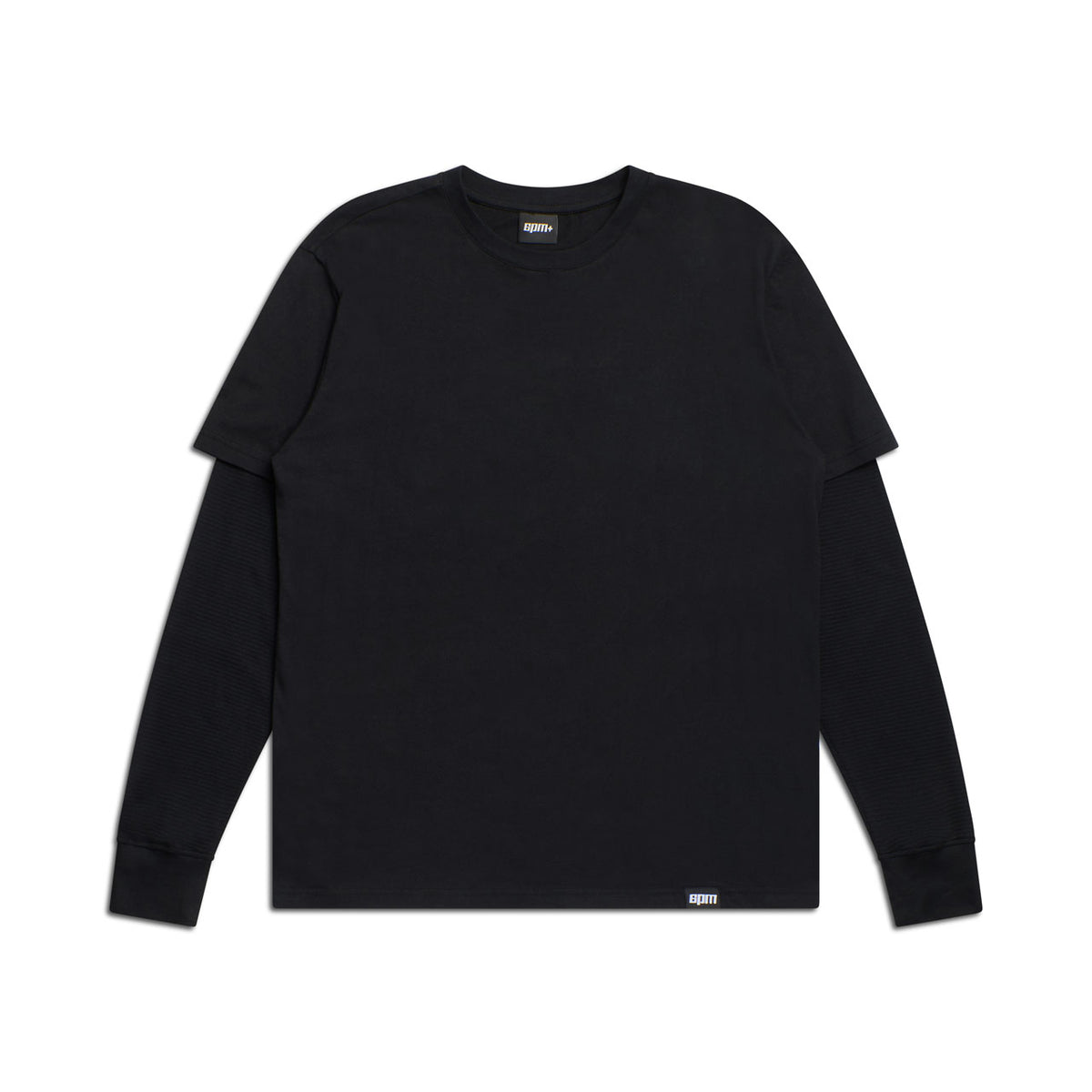 The 6PM LAYERED LONGSLEEVE BLACK is a plain black long-sleeve t-shirt, shown laid flat on a white background with subtle labels at the collar and hem.