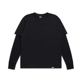 The 6PM LAYERED LONGSLEEVE BLACK is a plain black long-sleeve t-shirt, shown laid flat on a white background with subtle labels at the collar and hem.
