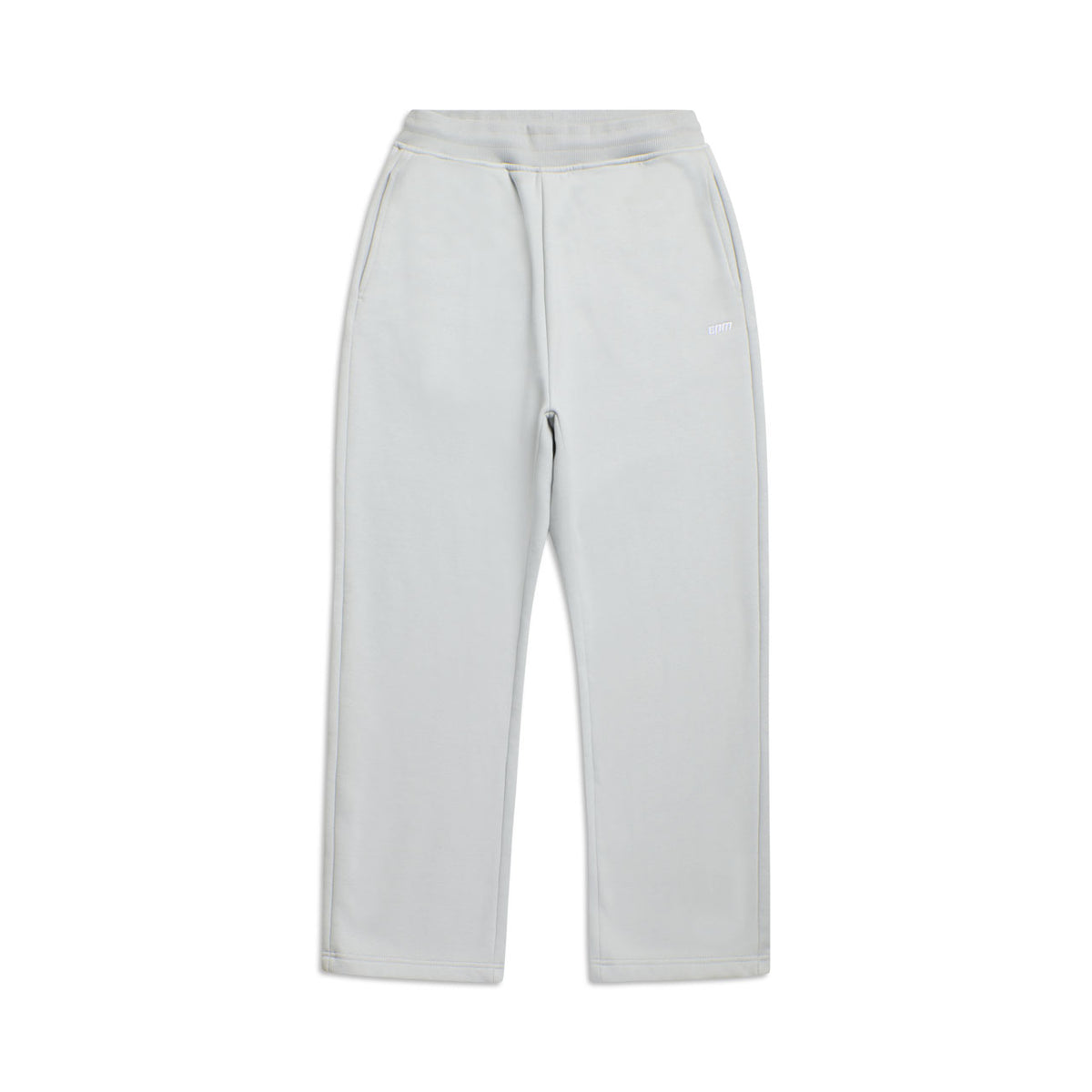 The OPEN LEG JOGGER SMOKE GREY features straight legs, an elastic waistband, and side pockets for a modern classic look; shown laid flat on a white background.
