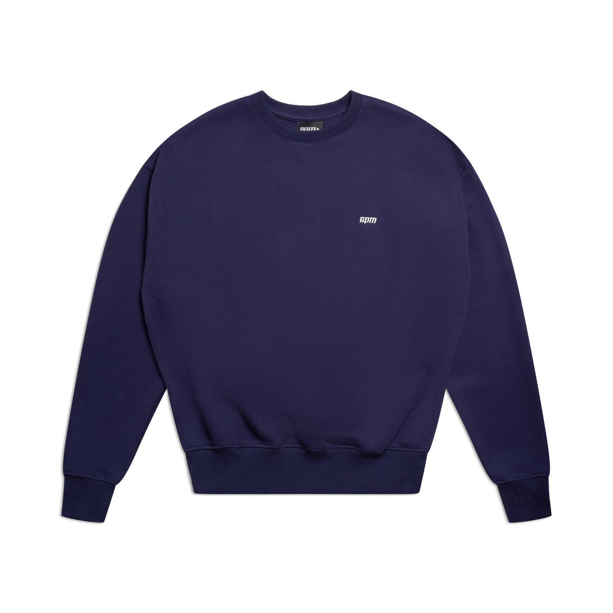 The CREWNECK ORBIT BLUE by 6PM is a navy blue crewneck sweatshirt with long sleeves, ribbed trims, and a small white spirit logo on the left chest, displayed flat on a white background.
