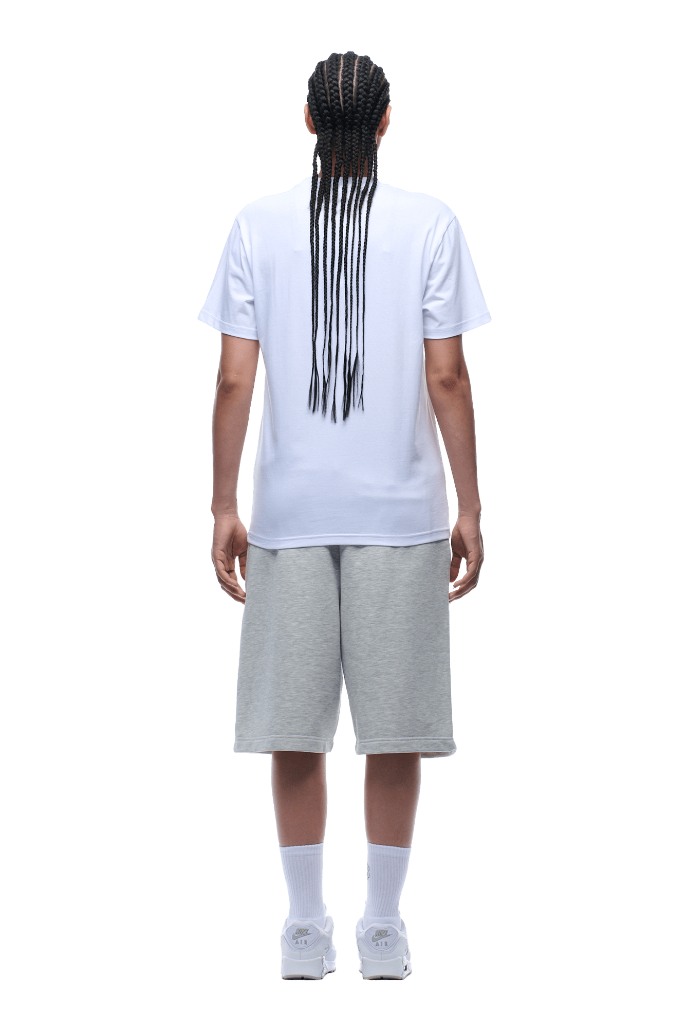 Person with long braids stands facing away, wearing the 6PM CLEAN EDGE WAVE TEE in white, gray knee-length shorts, white crew socks, and white sneakers; isolated on a transparent background.