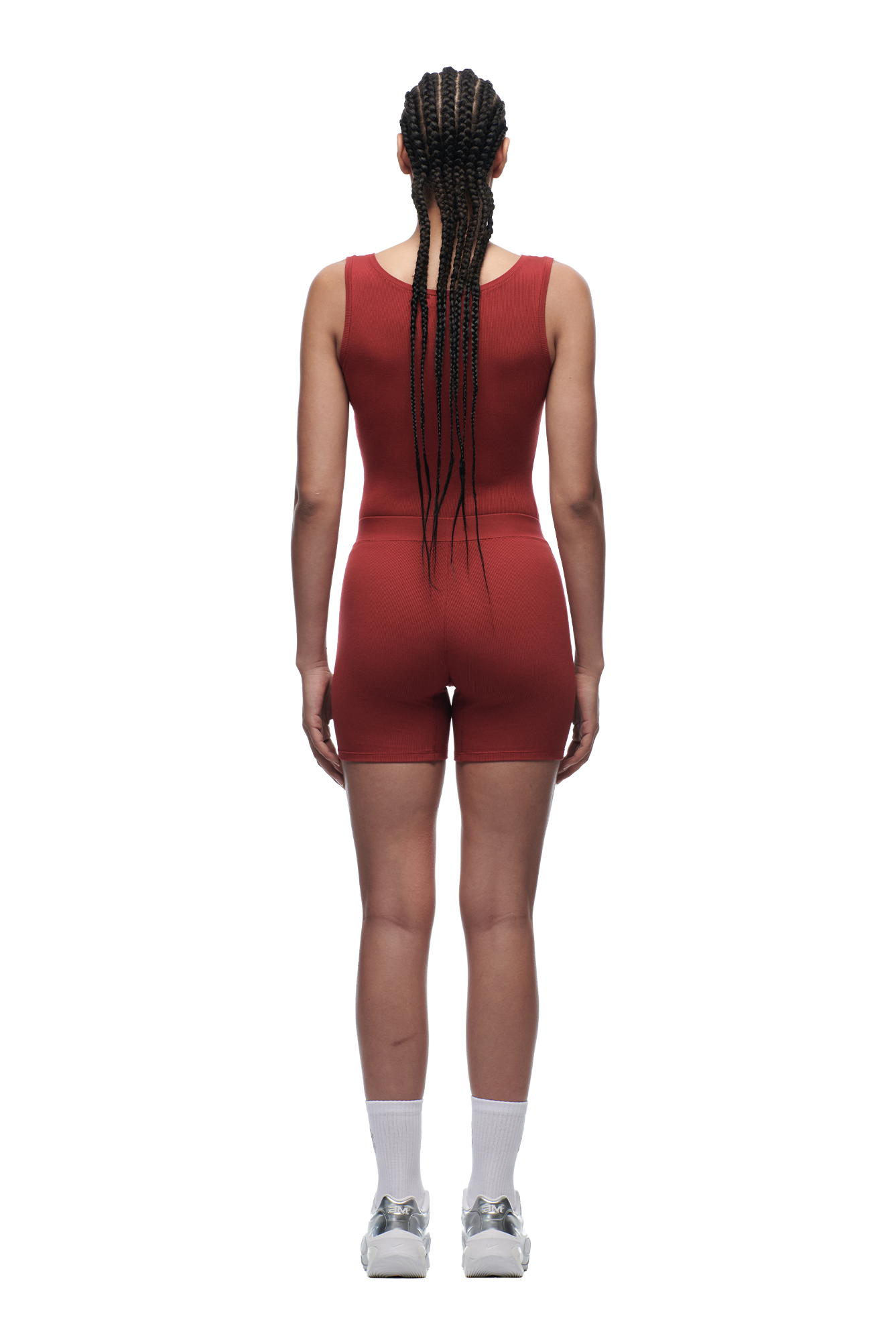 A person with long braids wears 6PM WMNS BOXER SHORTS WINE RED, along with white socks and sneakers, standing facing away on a white background.