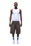A man faces forward wearing a white tank top, COATED DENIM SHORTS WASHED BROWN by 6PM, white sneakers, and white socks with blue and red stripes. The background is transparent.