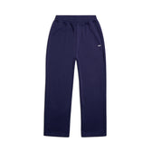 The 6PM OPEN LEG JOGGER ORBIT BLUE features a straight cut, stacking length for a modern classic look, an elastic waistband, side pockets, and a small white logo on the upper left thigh, shown on a white background.