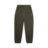 The 6PM CUFF JOGGER FOREST NIGHT features a classic fit in olive green with an elastic waistband, two side pockets, and cuffed leg openings. Pants are shown laid flat on a white background.