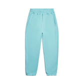 The 6PM CUFF JOGGER TURQUOISE features an elastic waistband, side pockets, and cuffed legs in a light blue hue, shown against a white background.