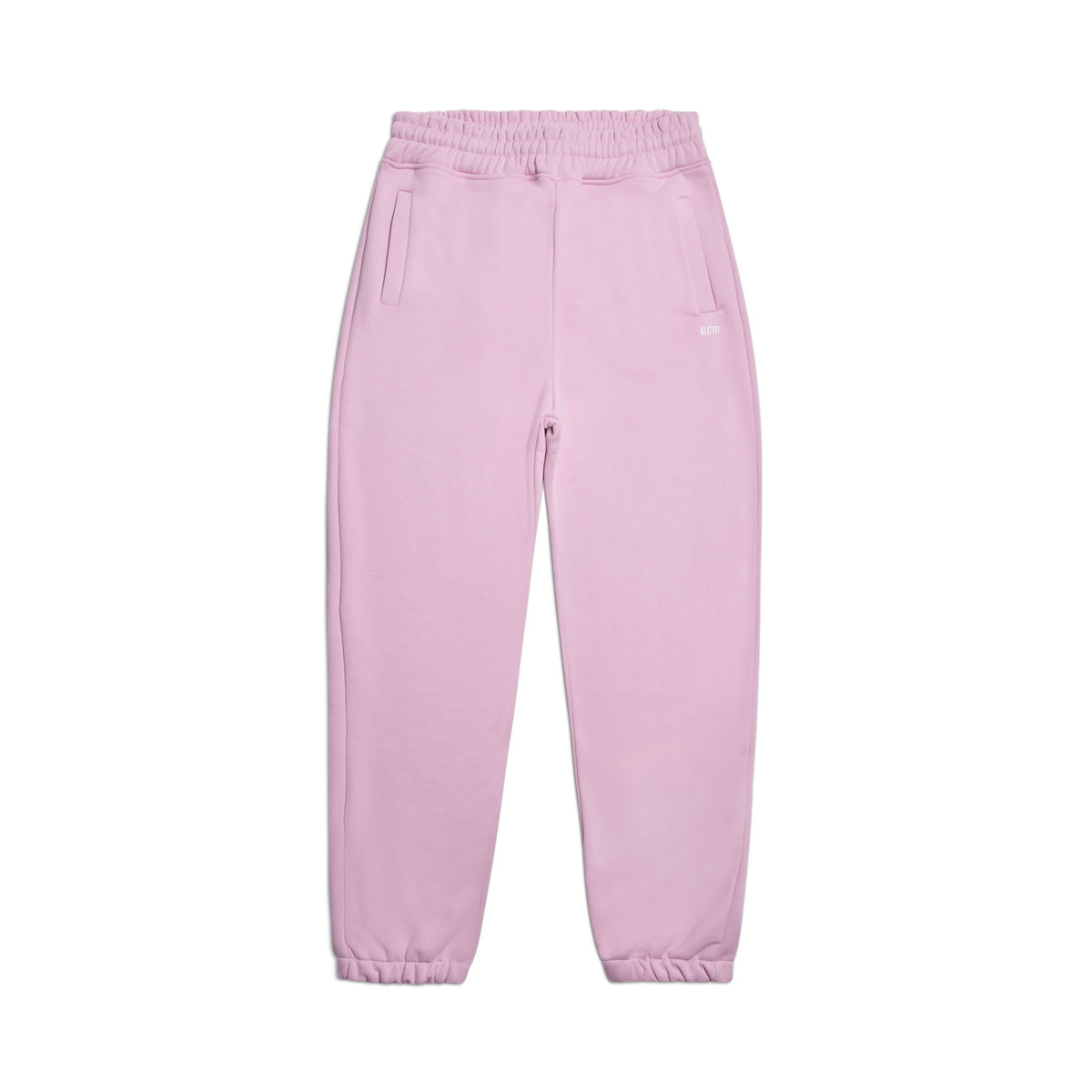 The CUFF JOGGER BABY PINK by 6PM is a relaxed fit sweatpant in light pink, featuring an elastic waistband, cuffed leg openings, and two side pockets, shown laid flat on a white background.