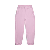 The CUFF JOGGER BABY PINK by 6PM is a relaxed fit sweatpant in light pink, featuring an elastic waistband, cuffed leg openings, and two side pockets, shown laid flat on a white background.