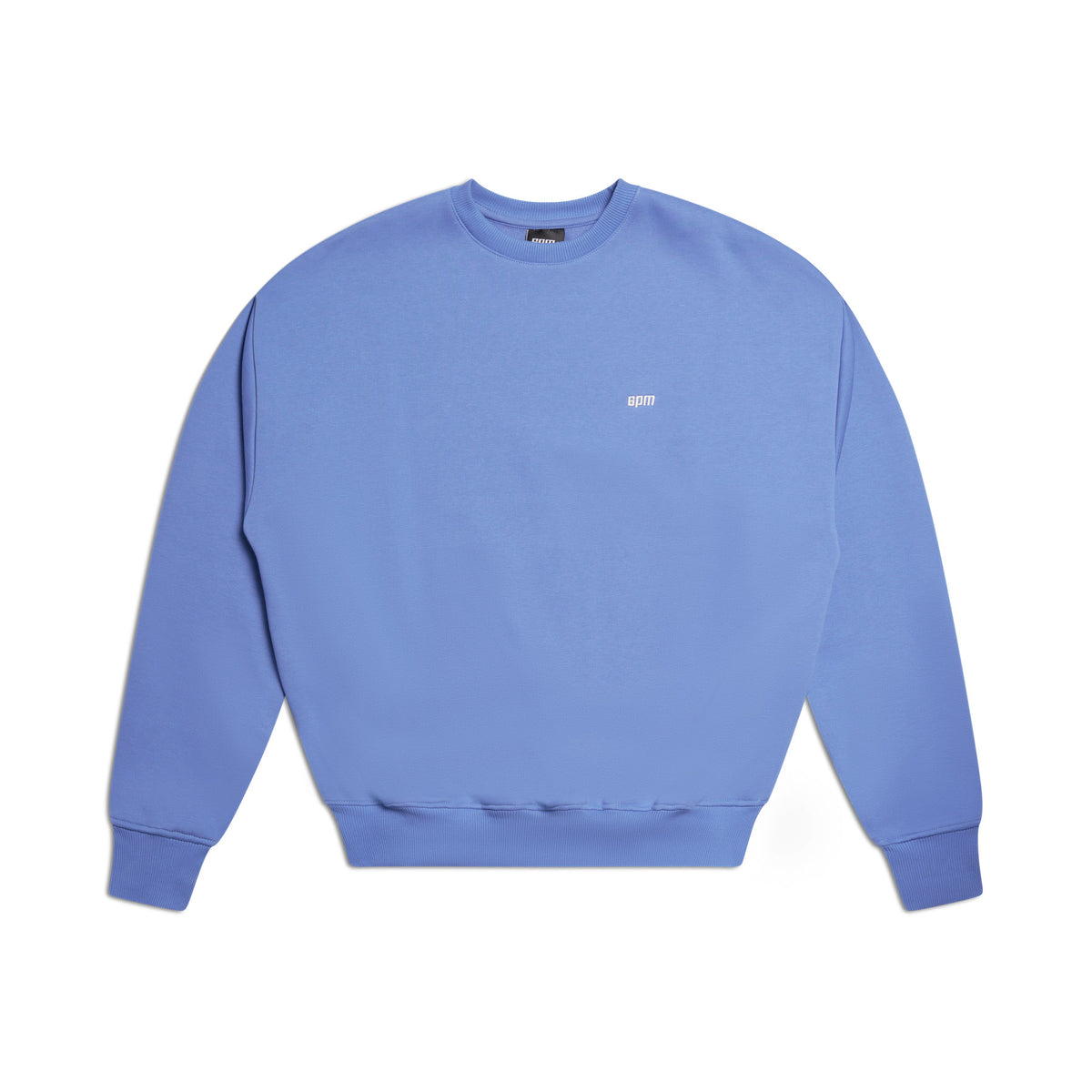 The 6PM CREWNECK PERSIAN BLUE is a light purple crewneck sweatshirt featuring long sleeves, ribbed trims, and a small white logo on the chest, shown laid flat on a white background.