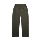 The 6PM OPEN LEG JOGGER FOREST NIGHT sweatpants feature a dark green color, stacking length, elastic waistband, side pockets, and a small white logo on the upper left thigh, shown on a plain white background.