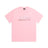 The CLEAN EDGE WAVE T-SHIRT PINK by 6PM features bold, white, stylized 6PM lettering outlined in pink across the chest. The light pink shirt is displayed flat on a white background.