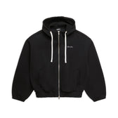 The 6PM BOXY ZIP HOODIE BLACK features white drawstrings, ribbed cuffs and hem, and small white text on the left chest. It is displayed laid flat on a white background.