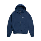 The 6PM ZIP HOODIE NAVY features a structured feel, front pouch pocket, ribbed cuffs and hem, and a small white chest logo, shown against a white background.