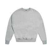 The 6PM CREWNECK GREY MELANGE is a light gray sweatshirt with long sleeves, ribbed collar, cuffs, and hem, featuring a small white logo on the left chest and shown against a white background.