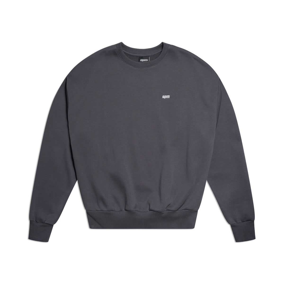 The 6PM CREWNECK ANTHRACITE is a plain, dark gray crewneck sweatshirt with a boxy fit, long sleeves, ribbed trims, and a small white embroidered logo on the chest, shown on a white background.