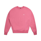 The 6PM CREWNECK HOT PINK is a boxy fit crewneck sweatshirt with long sleeves, ribbed trims, and a small white logo on the left chest, shown flat on a white background.