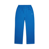 The OPEN LEG JOGGER PRINCESS BLUE by 6PM features bright blue open-leg pants with an elastic waistband, side pockets, and a small white logo on the thigh—a modern classic for everyday comfort. Displayed on a white background.