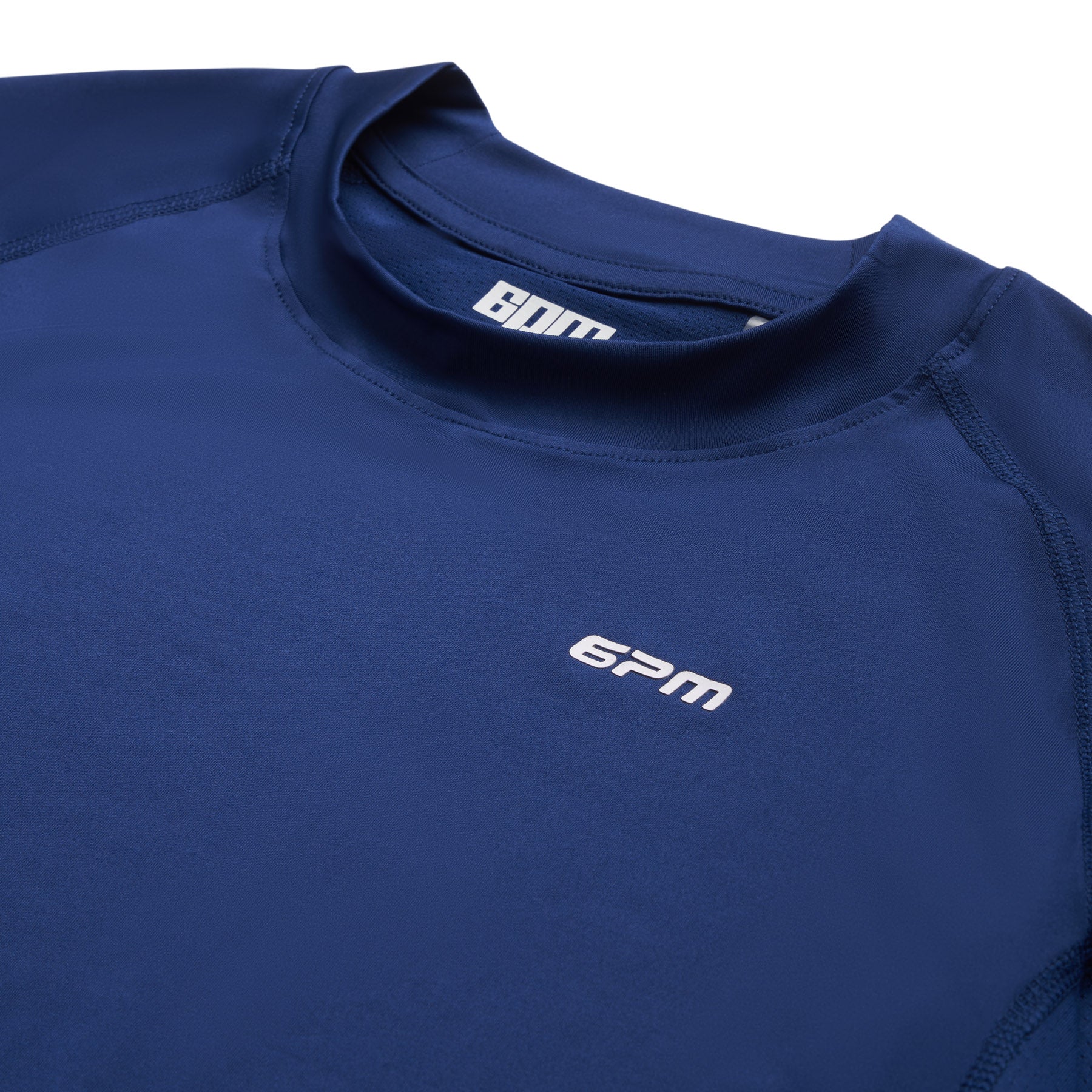 The 6PM SPORTS T-SHIRT DEEP SEA BLUE by 6PM is shown on a flat white background, featuring the signature white 6PM logo on both the collar and chest.
