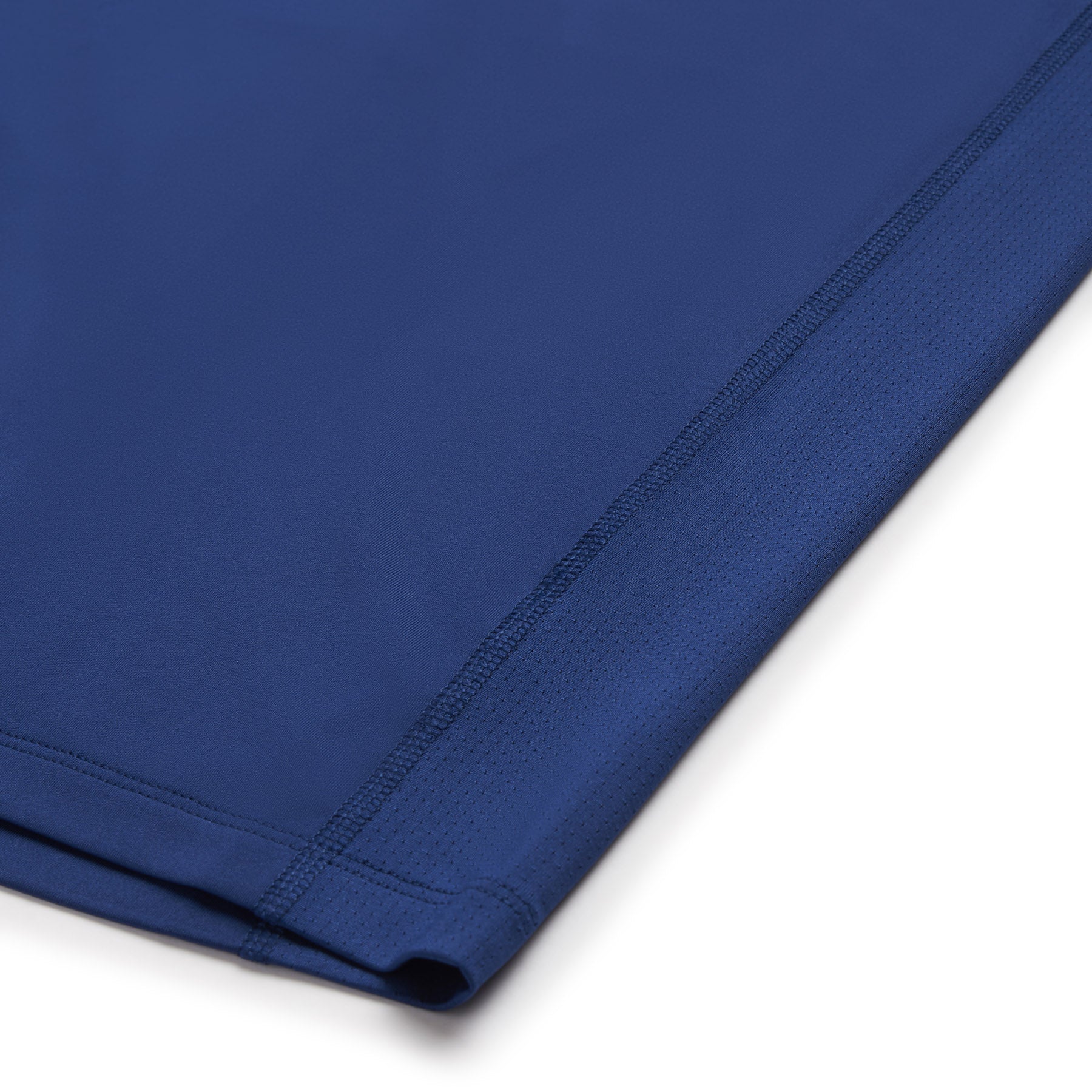 Close-up of the hem on the 6PM SPORTS T-SHIRT DEEP SEA BLUE by 6PM, highlighting its smooth fabric and neat stitching along the edge.