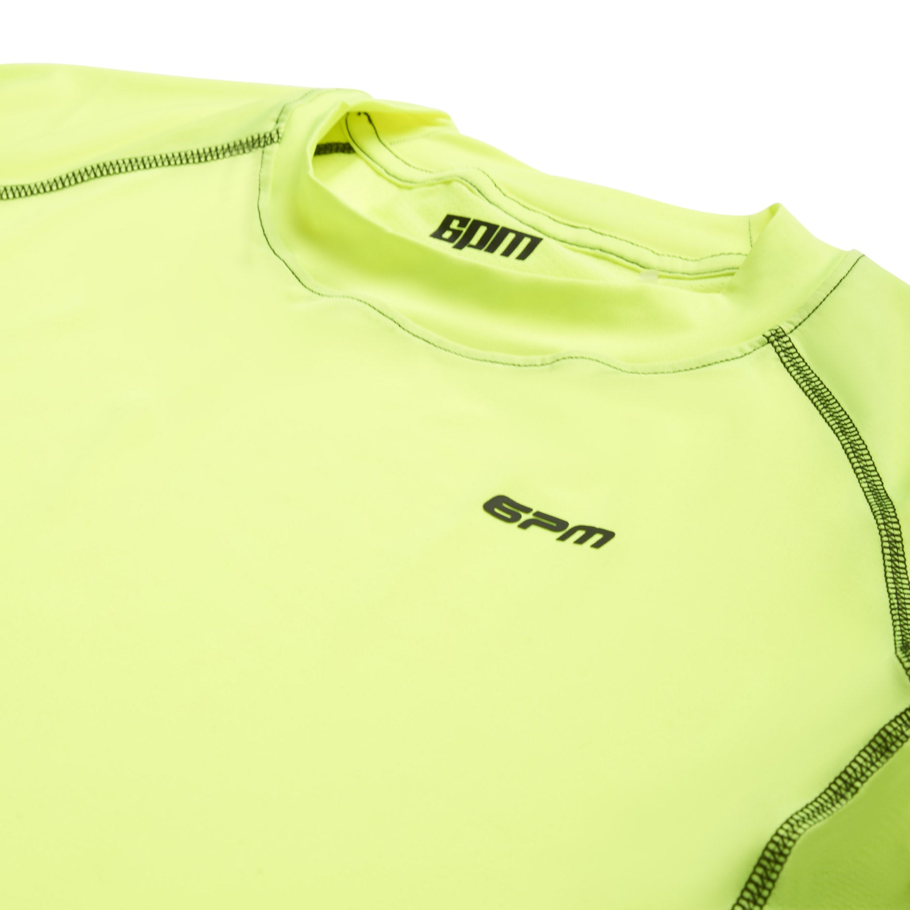 A close-up of the 6PM SPORTS T-SHIRT NEON YELLOW by 6PM shows visible stitching and the logo on the chest and collar, with the neon yellow shirt laid flat on a white surface.