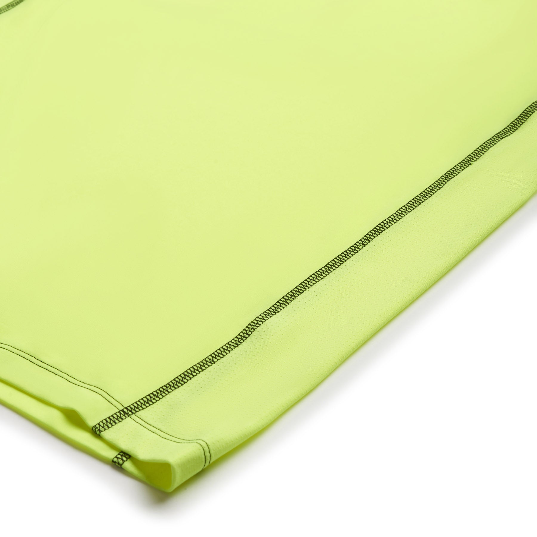 Close-up of the 6PM SPORTS T-SHIRT NEON YELLOW by 6PM, highlighting its vibrant yellow-green fabric and visible dark stitching along the edge for detailed material and seam finish.