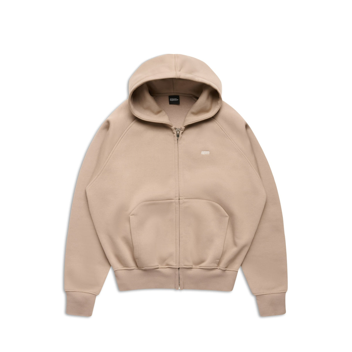 The 6PM ZIP HOODIE MOCCA CREAM is a beige zip-up hoodie with a front pocket, hood, and minimalist design. It features a small embroidered logo on the left chest and a clean finish, perfect for everyday wear. Laid flat on a white background.