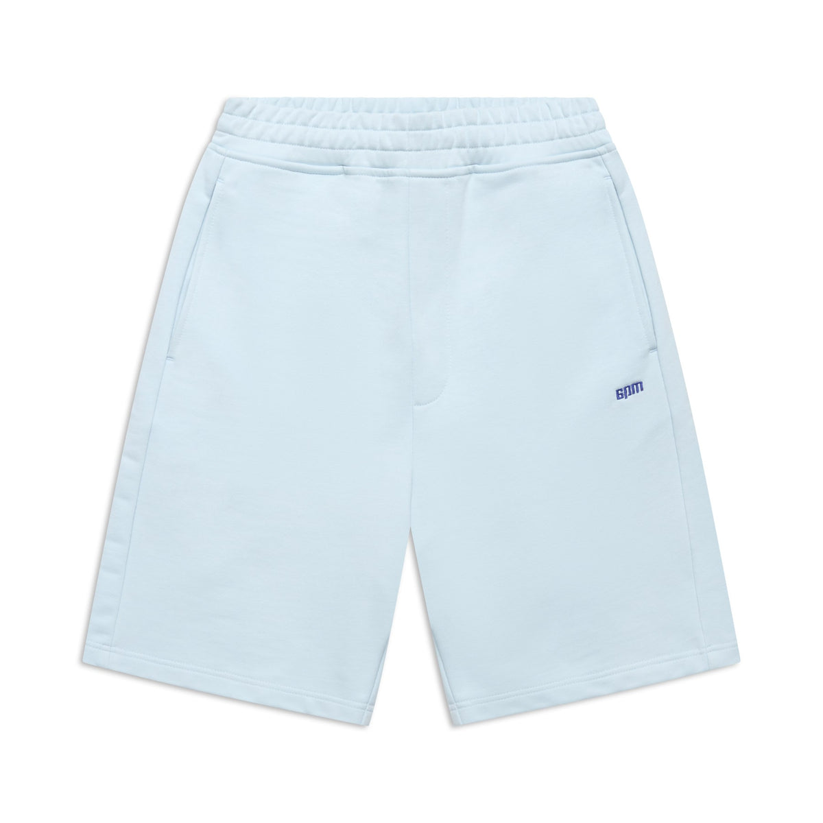 The 6PM+ SHORTS ICE BLUE feature a relaxed fit, elastic waistband, two side pockets, and a small blue 8PM logo on the left thigh. These light blue athletic shorts have a soft interior and are shown laid flat against a white background.