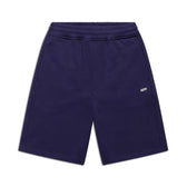 The 6PM+ SHORTS ORBIT BLUE by 6PM are dark blue athletic shorts featuring a relaxed fit, elastic waistband, side pockets, and a small white CDTM logo on the left thigh. Laid flat on a white background—perfect for lounging.