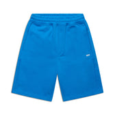 The 6PM+ SHORTS PRINCESS BLUE by 6PM are bright blue athletic shorts with a relaxed fit, elastic waistband, side pockets, and a small white logo on the left leg—ideal for lounging.
