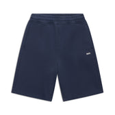 6PM+ SHORTS NAVY by 6PM: navy blue athletic shorts with a relaxed fit, elastic waistband, drawstring waist, side pockets, and a small white 6PM logo on the left leg, shown flat on a white background.