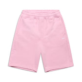 The 6PM+ SHORTS BABY PINK by 6PM feature a relaxed fit, elastic waistband, side pockets, and a subtle white logo on the left leg. The soft, casual shorts are shown laid flat on a white background.