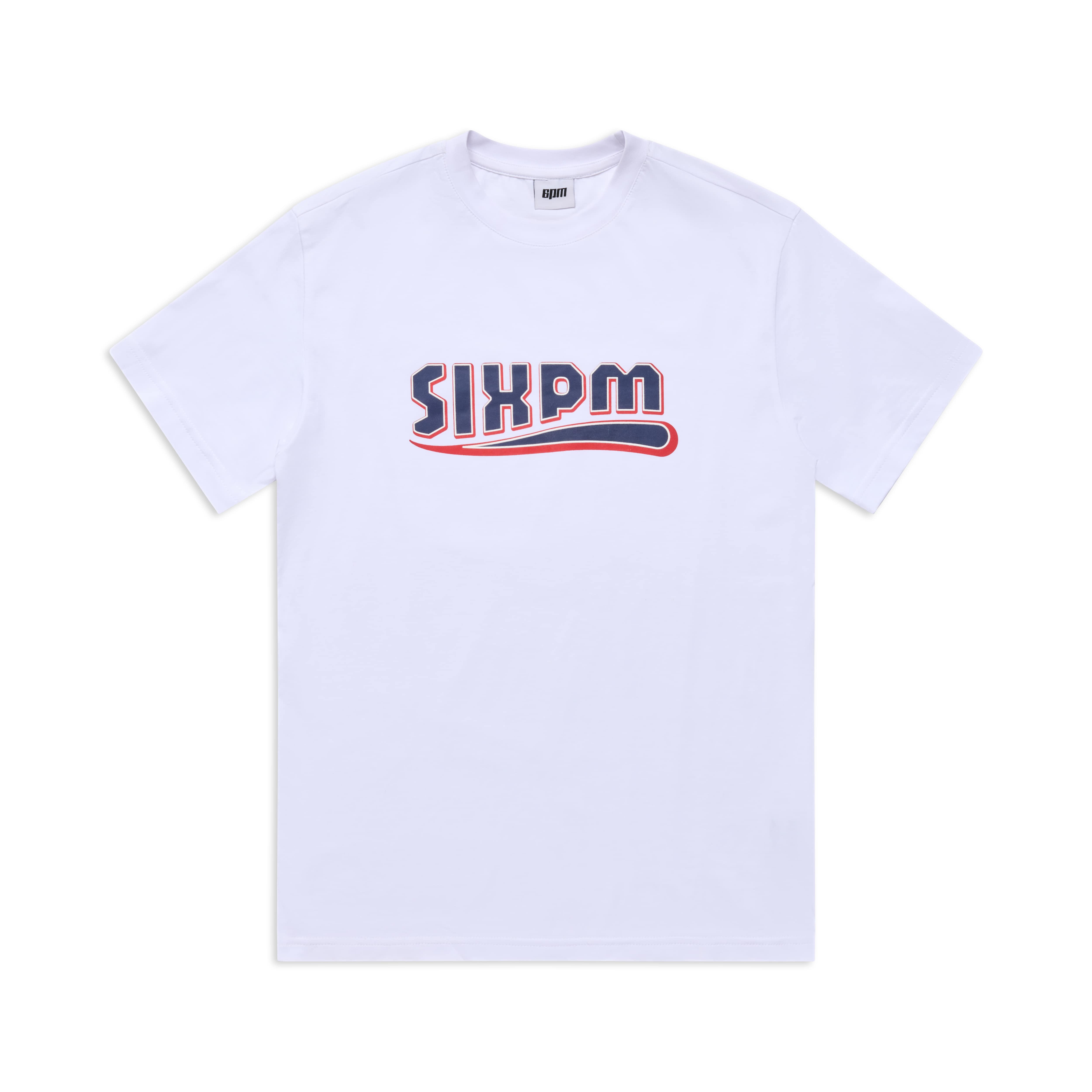 The CLEAN EDGE WAVE TEE WHITE by 6PM is a plain white T-shirt with the brand name 6PM in bold, stylized navy blue and red letters across the chest.