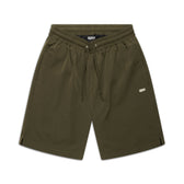 6PM SEERSUCKER SWIM SHORTS in olive feature an elastic waistband, drawstring, side pockets, and a small white BPM logo on the left leg, shown on a white background.