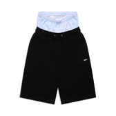 The 6PM BOXERS SHORTS BLACK feature a drawstring waist and a blue and white pinstriped inner layer, creating a distinctive double-waistband boxer-inspired look.